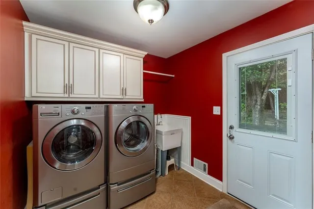 a utility room with dryer and washer
