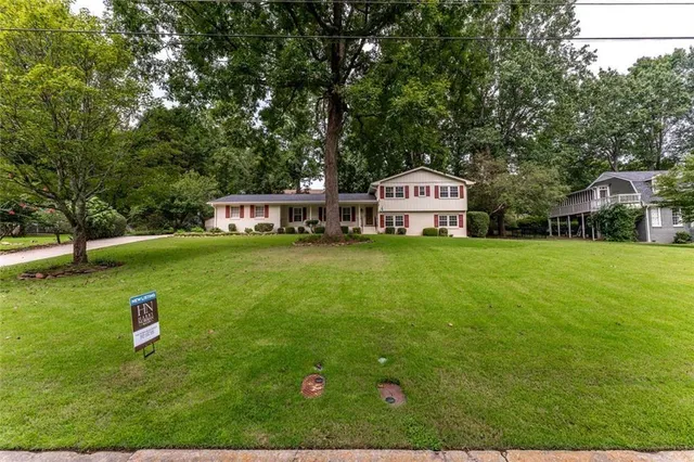 a front view of a house with a yard