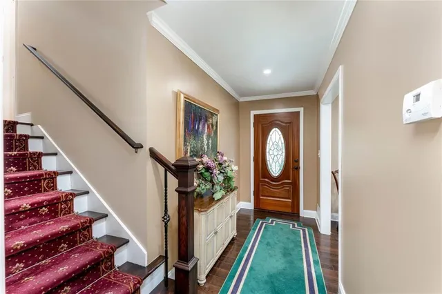 a view of entryway with wooden floor
