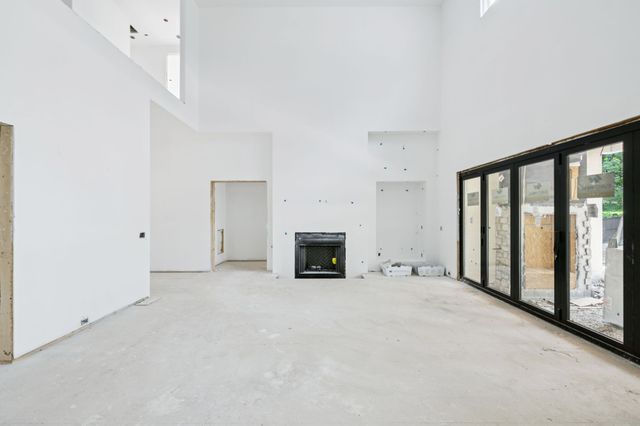 an empty room with fireplace