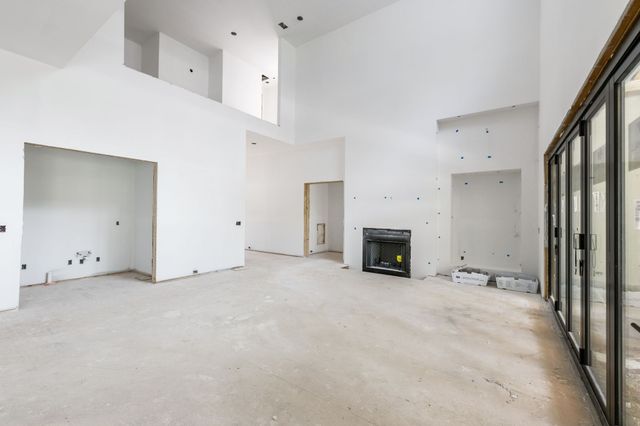 a view of empty room with fireplace