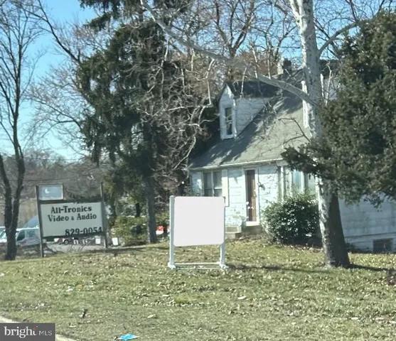 a backyard of a house with oven and outdoor seating