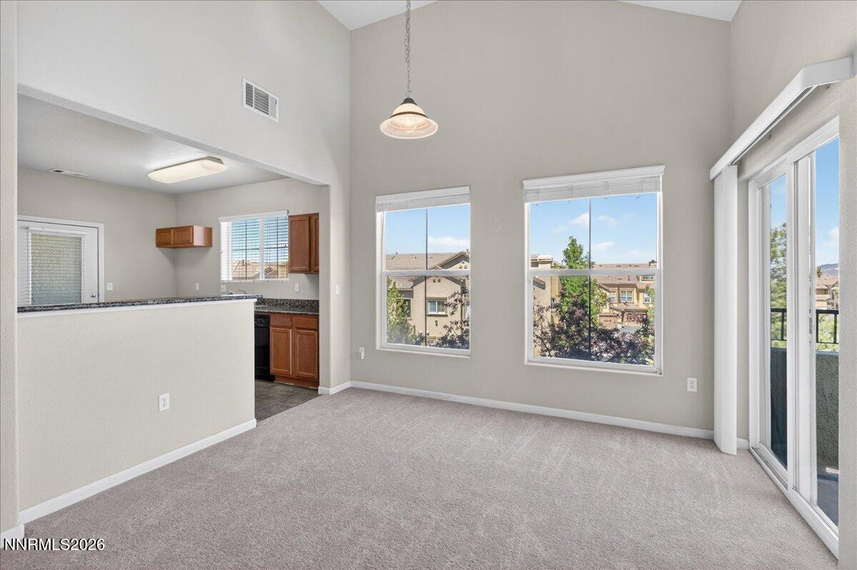 17000 Wedge Parkway, Unit 1525 Reno, NV 89511 - Photo 14 of 42 a view of a kitchen and window with furniture in kitchen