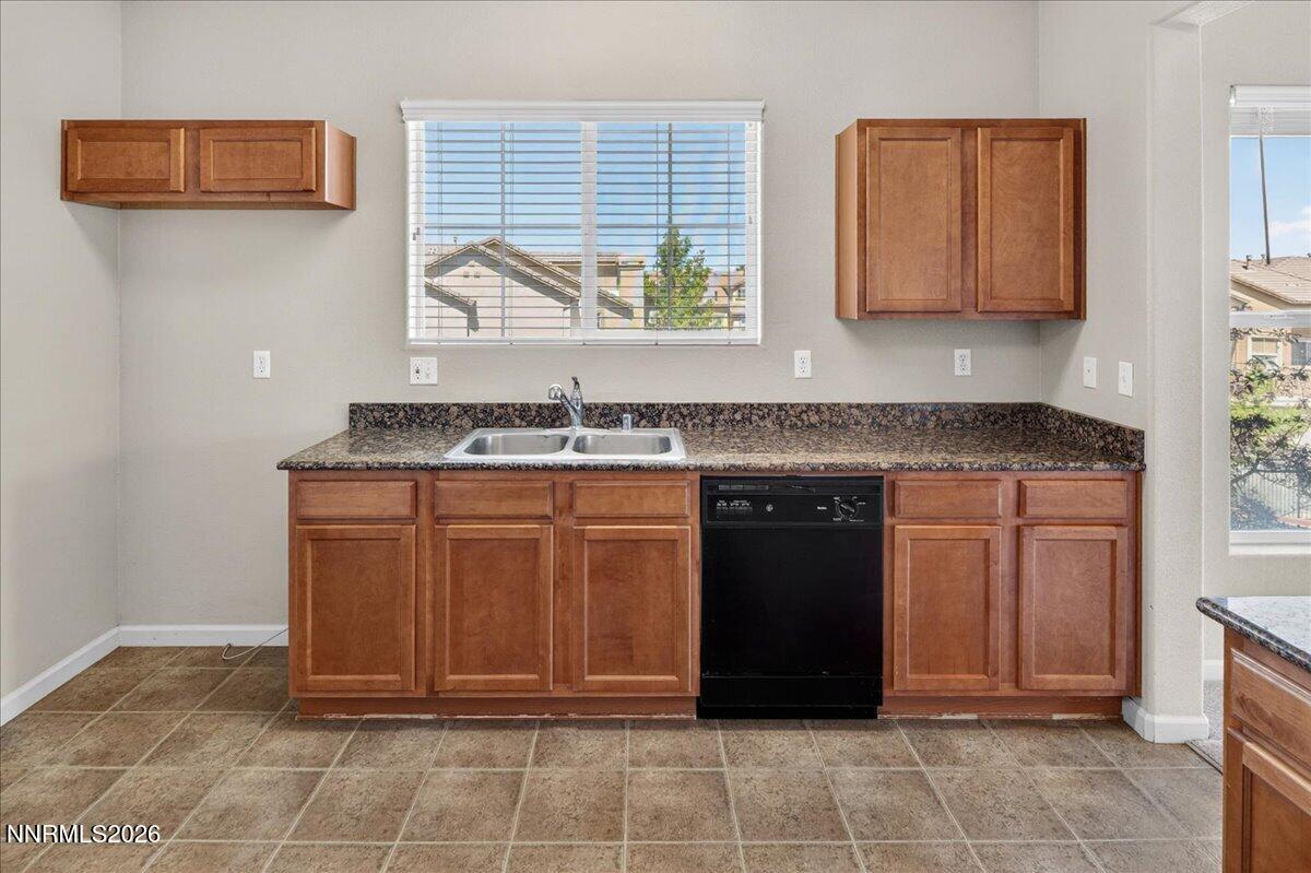 17000 Wedge Parkway, Unit 1525 Reno, NV 89511 - Photo 17 of 42 a kitchen with a stove top oven and cabinets