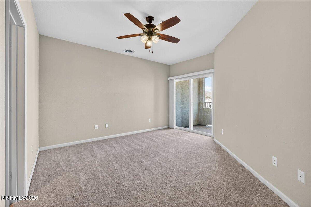 17000 Wedge Parkway, Unit 1525 Reno, NV 89511 - Photo 19 of 42 an empty room with closet and ceiling fan