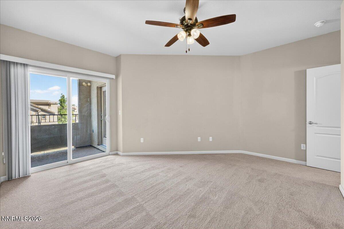 17000 Wedge Parkway, Unit 1525 Reno, NV 89511 - Photo 20 of 42 an empty room with fan and entrance