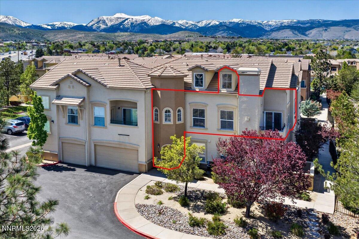 17000 Wedge Parkway, Unit 1525 Reno, NV 89511 - Photo 2 of 42 a view of a house with a yard and a large tree