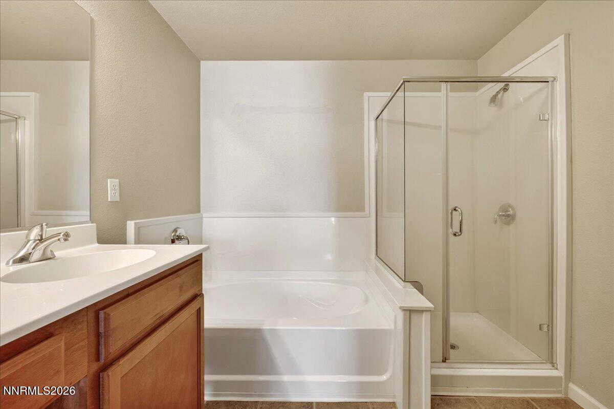 17000 Wedge Parkway, Unit 1525 Reno, NV 89511 - Photo 26 of 42 a bathroom with a shower and a sink