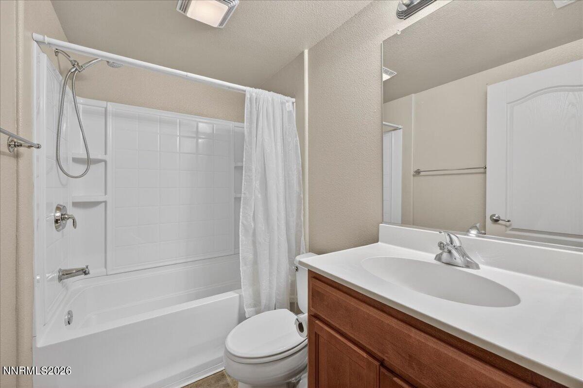 17000 Wedge Parkway, Unit 1525 Reno, NV 89511 - Photo 31 of 42 a bathroom with a sink toilet and shower