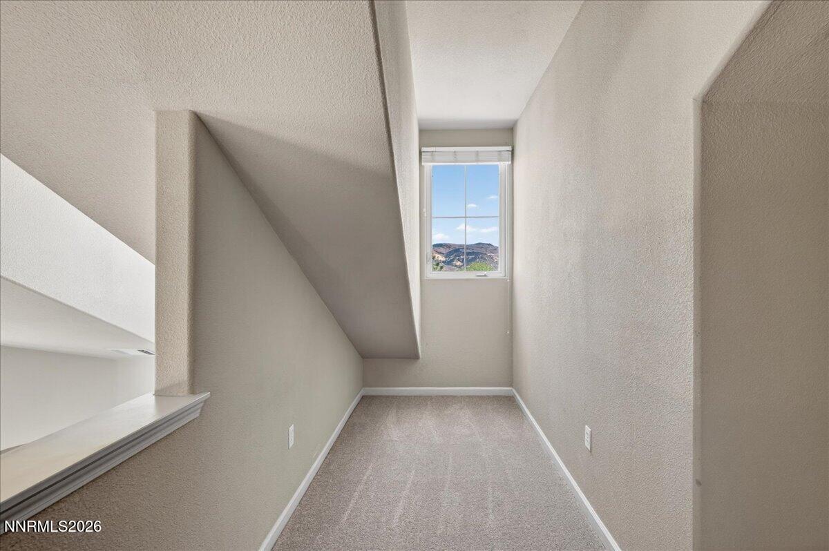 17000 Wedge Parkway, Unit 1525 Reno, NV 89511 - Photo 34 of 42 a view of a hallway with wooden floor and entryway