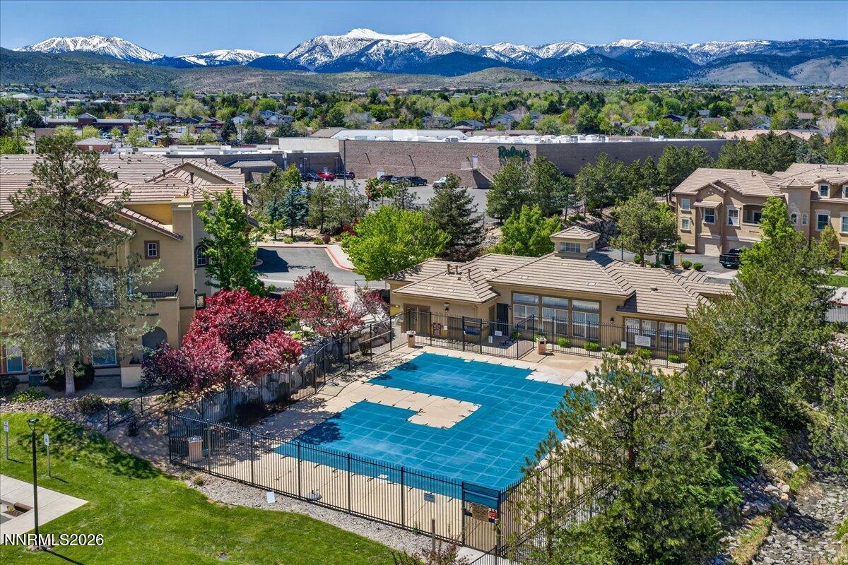 17000 Wedge Parkway, Unit 1525 Reno, NV 89511 - Photo 39 of 42 an aerial view of house with yard swimming pool and mountains