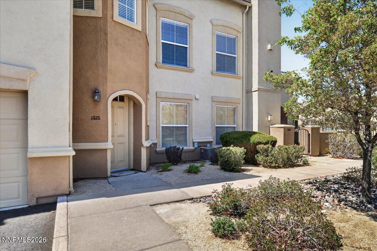 17000 Wedge Parkway, Unit 1525 Reno, NV 89511 - Photo 4 of 42 a front view of a house with a yard