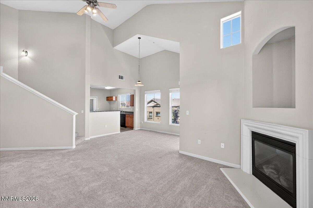 17000 Wedge Parkway, Unit 1525 Reno, NV 89511 - Photo 8 of 42 a view of a livingroom with a fireplace a sink and dishwasher kitchen view