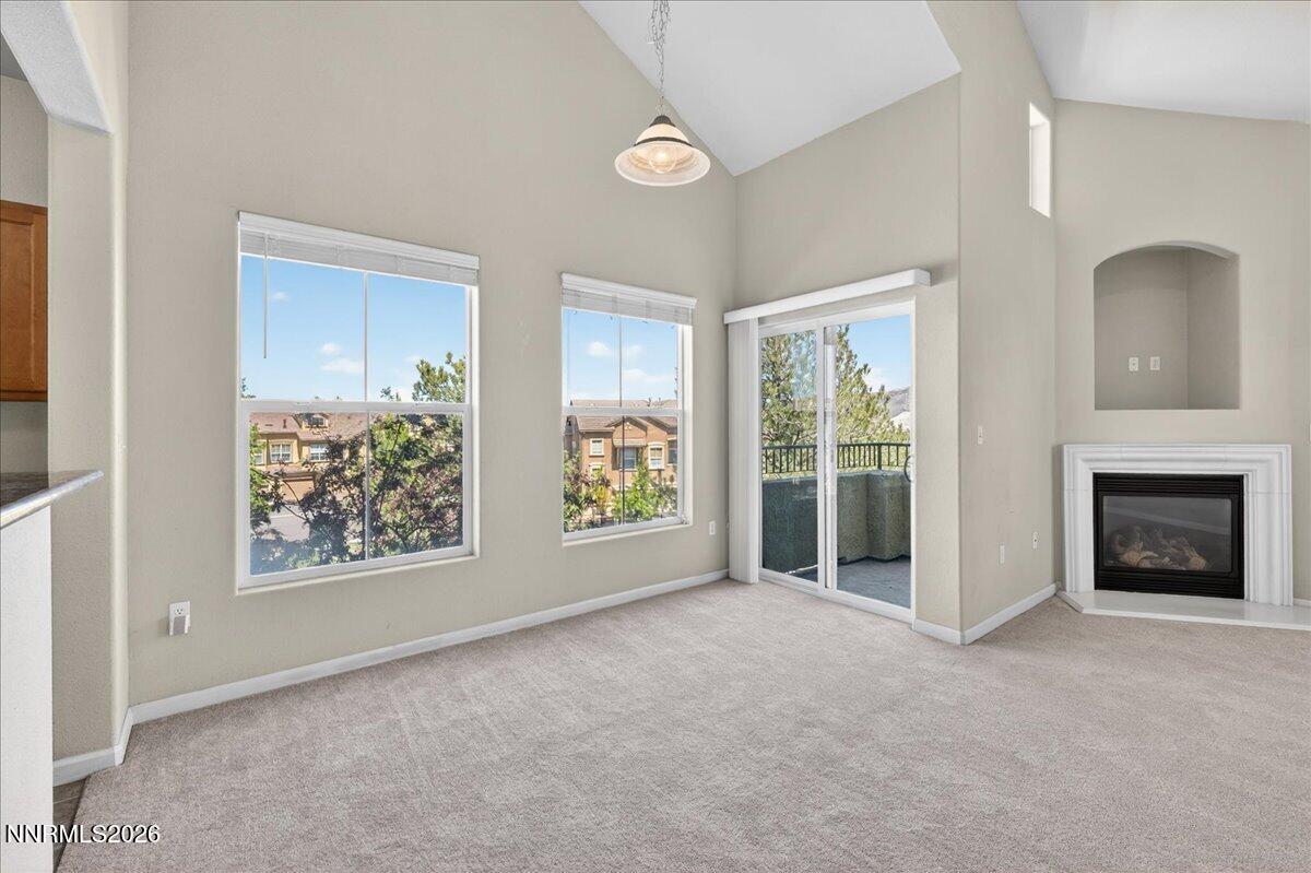 17000 Wedge Parkway, Unit 1525 Reno, NV 89511 - Photo 10 of 42 a view of a livingroom with an empty space and a fireplace