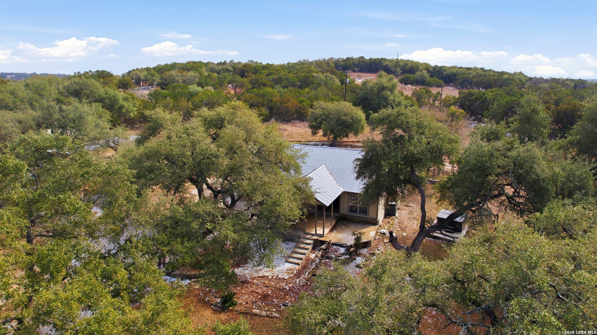 226 Shearer Road Bulverde, TX 78163 - Photo 25 of 27 an aerial view of a house with mountain view
