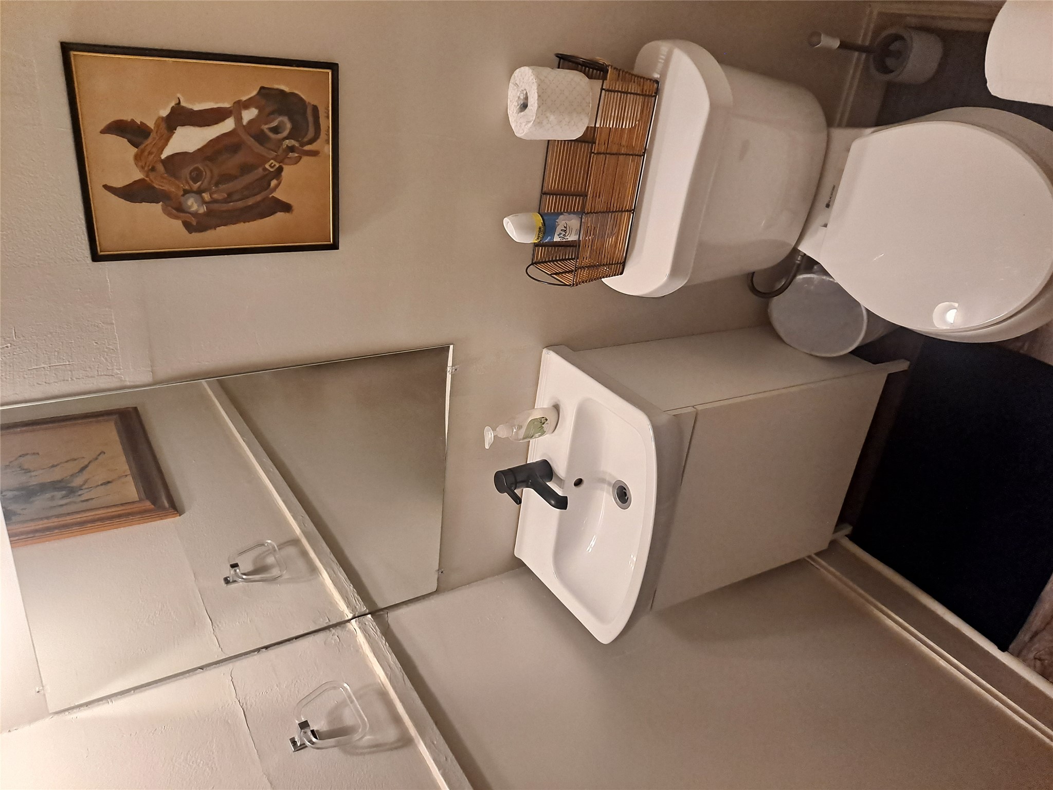 1906 San Gabriel Street, Unit 9 Austin, TX 78705 - Photo 6 of 9 Half bathroom with vanity and toilet