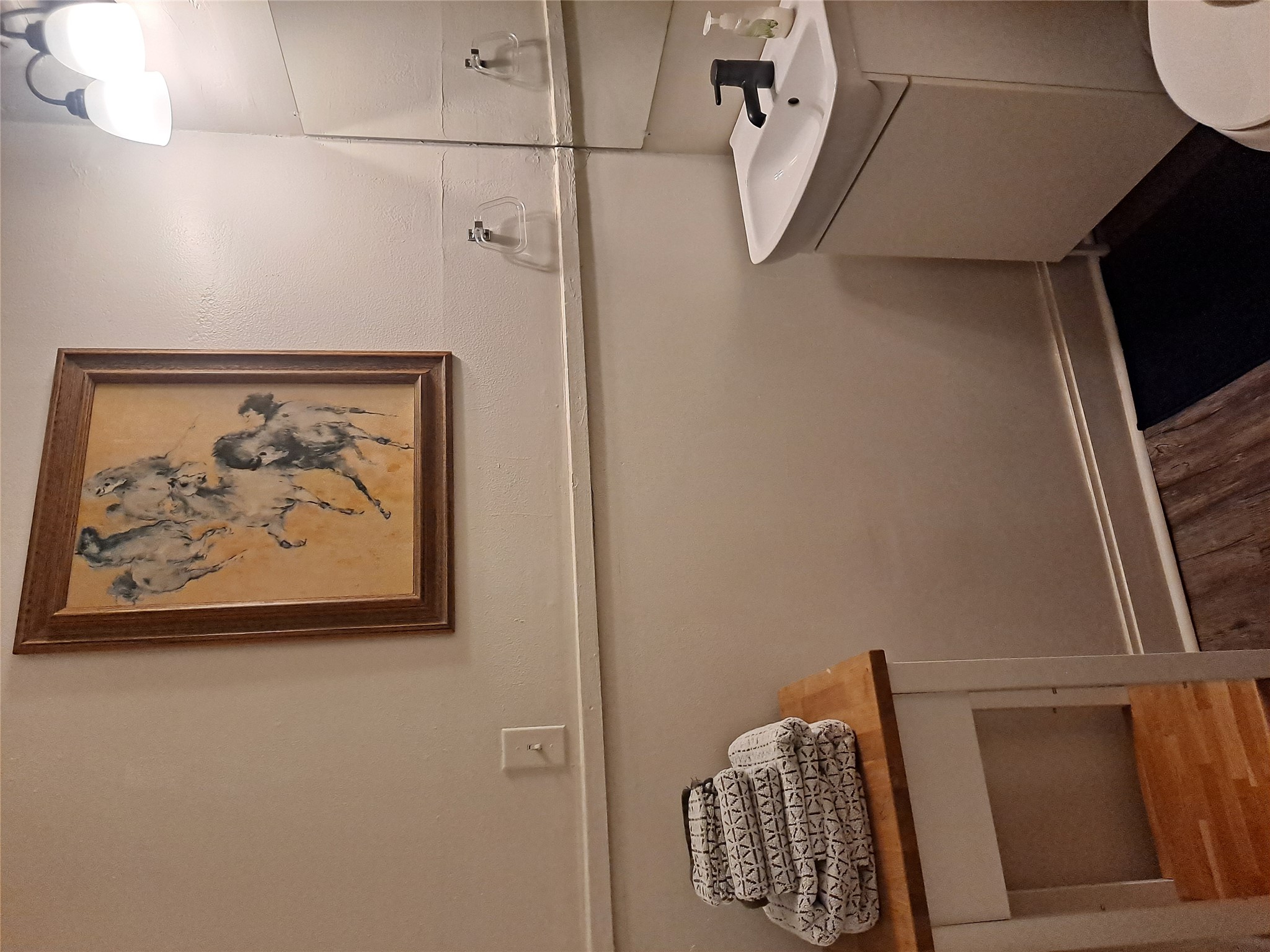 1906 San Gabriel Street, Unit 9 Austin, TX 78705 - Photo 7 of 9 Half bath featuring vanity and dark wood-style floors