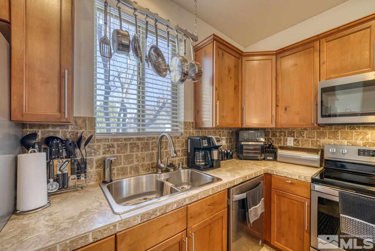 3677 Warren Way, Unit A Reno, NV 89509 - Photo 12 of 22 a kitchen with a sink and a stove top oven