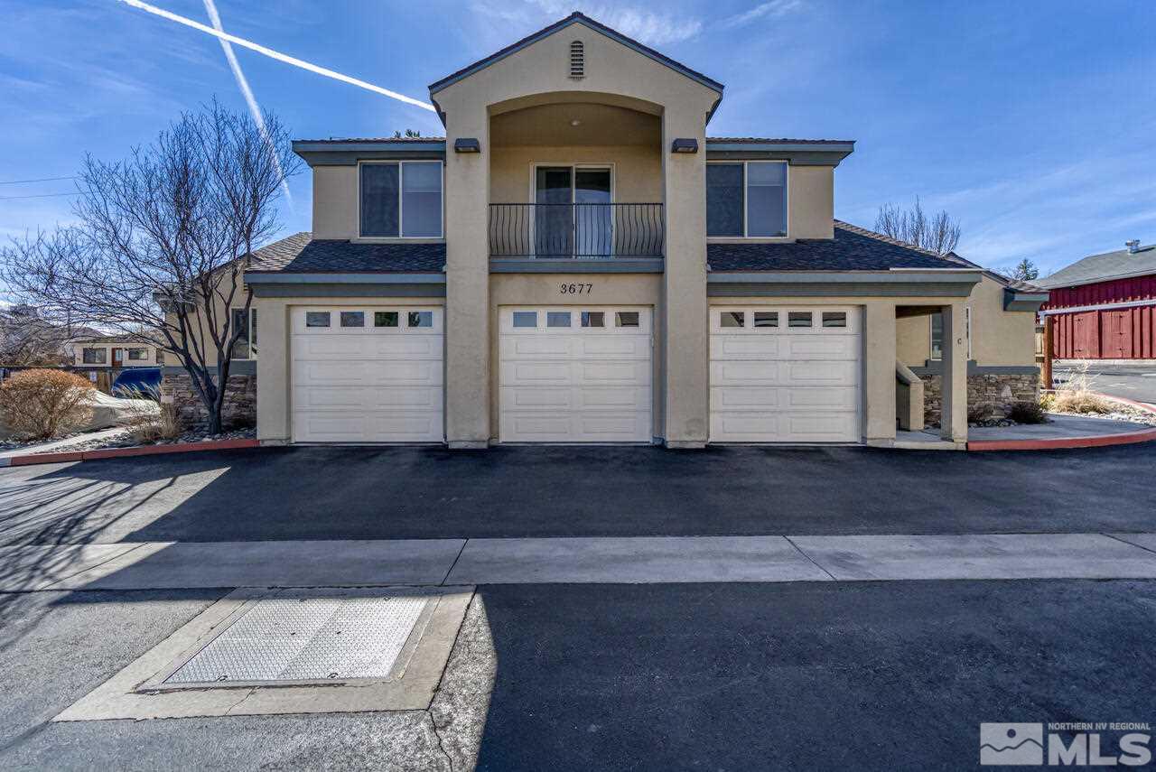 3677 Warren Way, Unit A Reno, NV 89509 - Photo 2 of 22 a front view of a house with a yard
