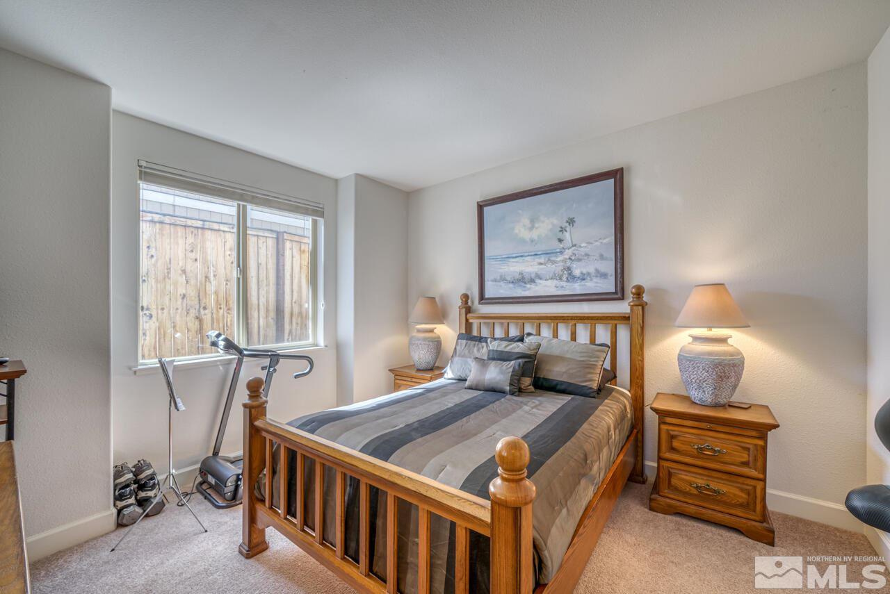 3677 Warren Way, Unit A Reno, NV 89509 - Photo 8 of 22 a bedroom with a bed and a window