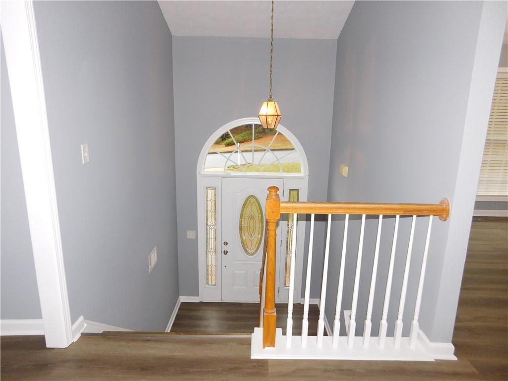 2614 Carolina Court Bethlehem, GA 30620 - Photo 11 of 42 a view of a hallway with wooden floor and a window