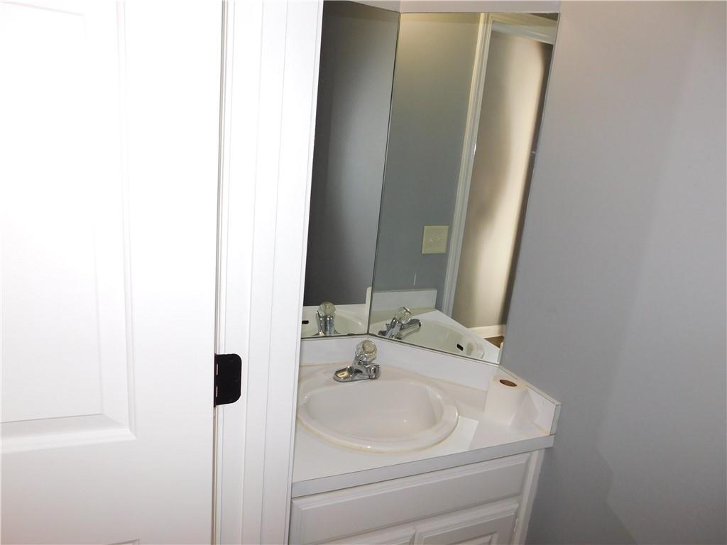 2614 Carolina Court Bethlehem, GA 30620 - Photo 22 of 42 a bathroom with a sink and a mirror