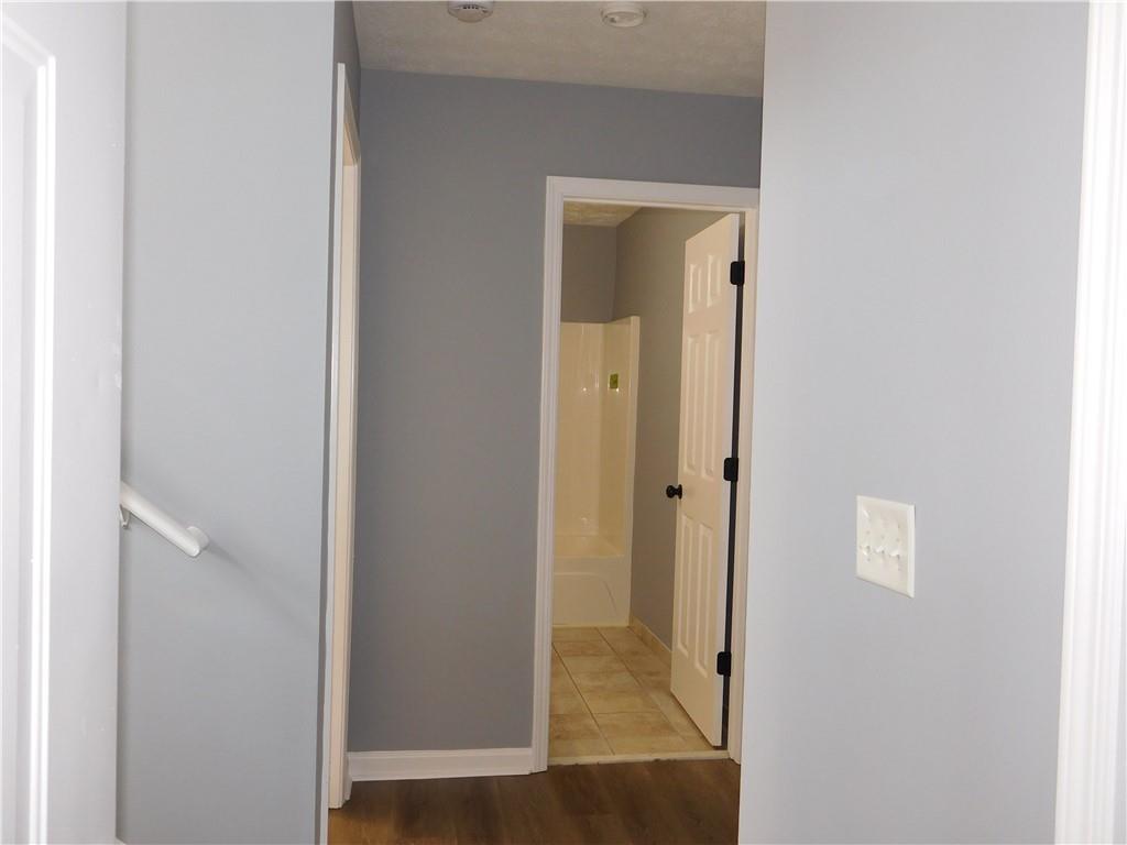 2614 Carolina Court Bethlehem, GA 30620 - Photo 29 of 42 a view of a hallway with wooden floor