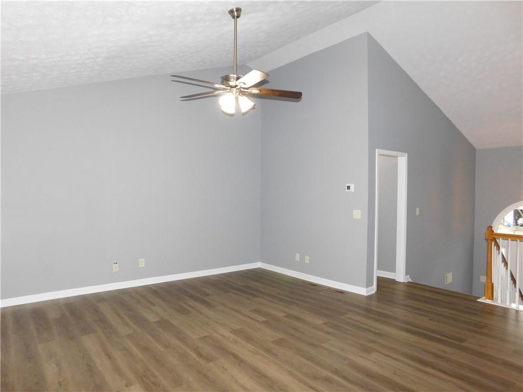 2614 Carolina Court Bethlehem, GA 30620 - Photo 9 of 42 a view of empty room with wooden floor and ceiling fan