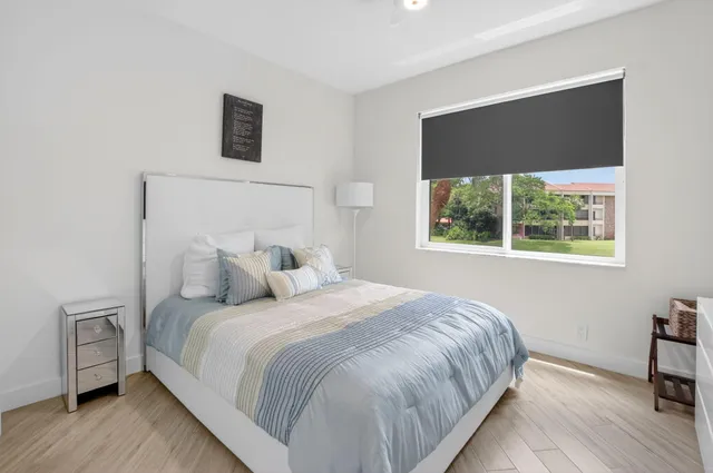 a bedroom with a bed and a tv