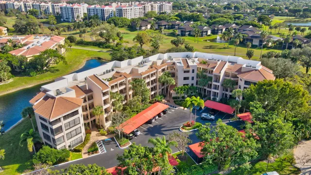 an aerial view of house with yard swimming pool and outdoor seating