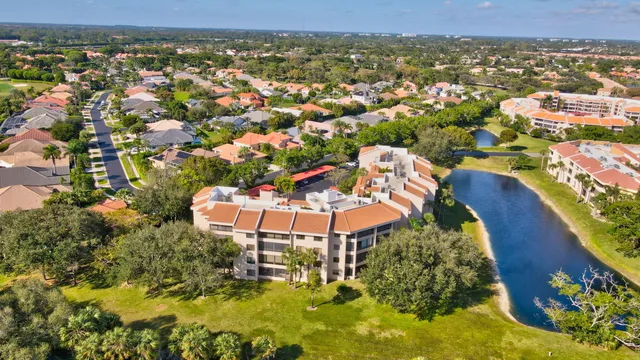 an aerial view of a house with a ocean view