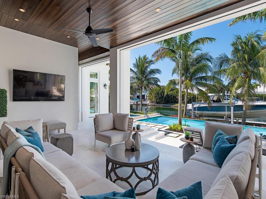 3320 Rum Row Naples, FL 34102 - Photo 13 of 39 a outdoor living space with furniture