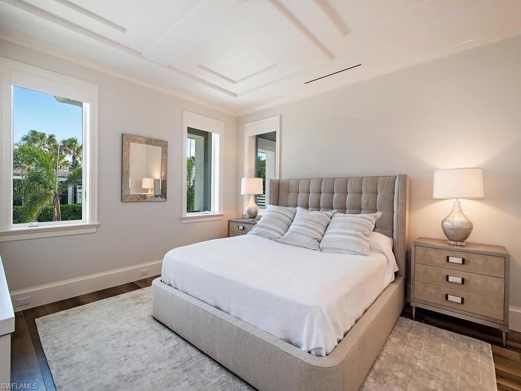 3320 Rum Row Naples, FL 34102 - Photo 27 of 39 a bedroom with a bed and a tv