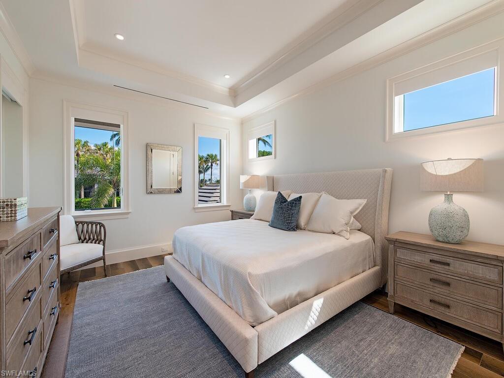 3320 Rum Row Naples, FL 34102 - Photo 31 of 39 a bedroom with a bed and window