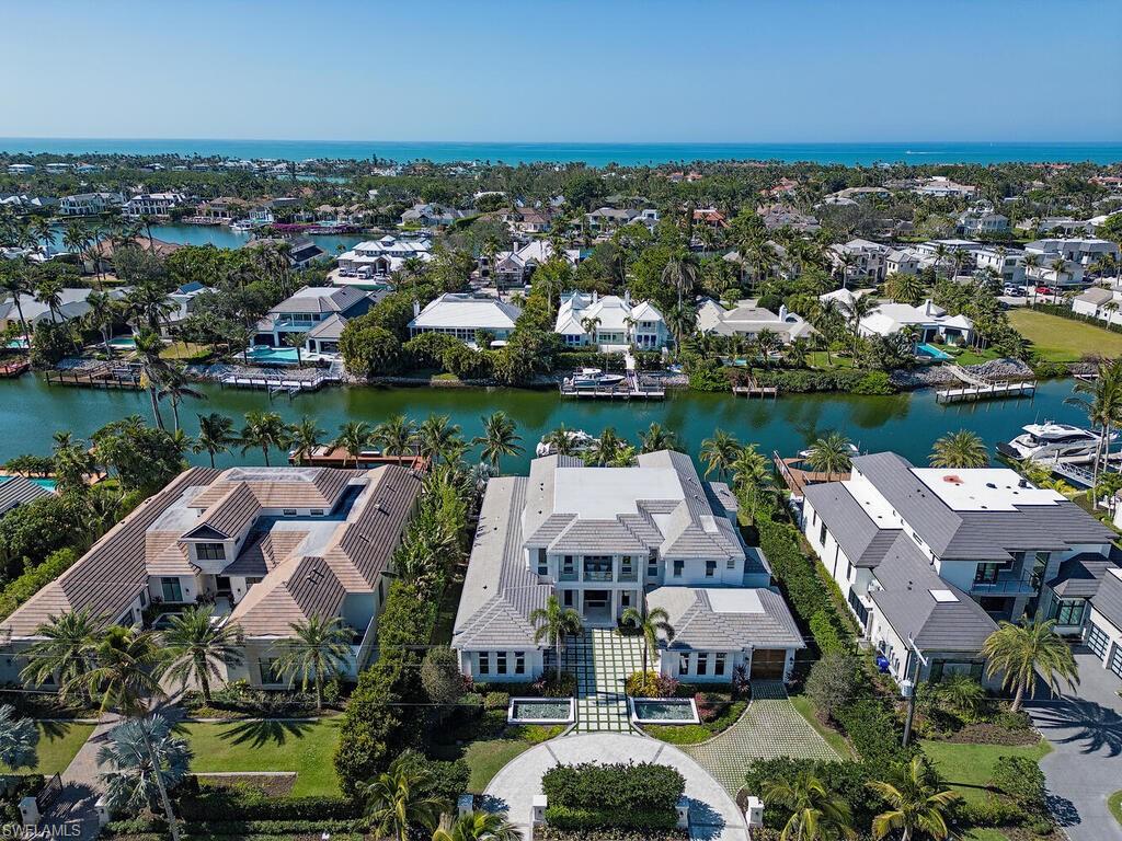 3320 Rum Row Naples, FL 34102 - Photo 35 of 39 an aerial view of a houses with a lake view