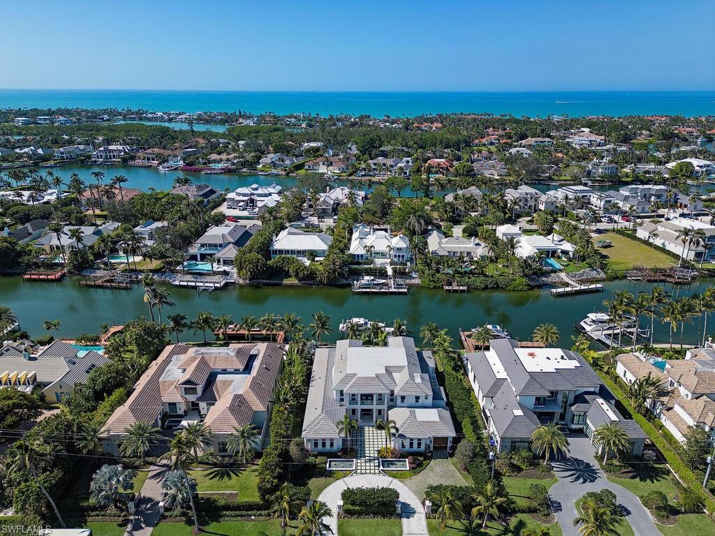 3320 Rum Row Naples, FL 34102 - Photo 36 of 39 an aerial view of lake residential house with outdoor space and lake view in back