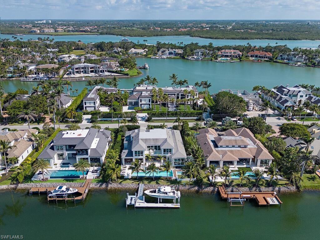 3320 Rum Row Naples, FL 34102 - Photo 37 of 39 an aerial view of a houses with a lake view