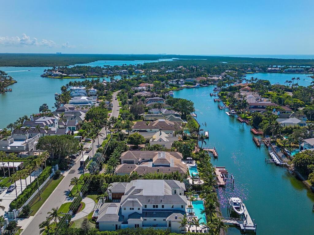3320 Rum Row Naples, FL 34102 - Photo 39 of 39 an aerial view of a city with ocean view