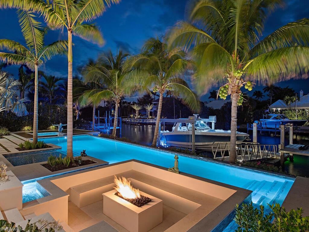 3320 Rum Row Naples, FL 34102 - Photo 5 of 39 a view of a backyard with swimming pool