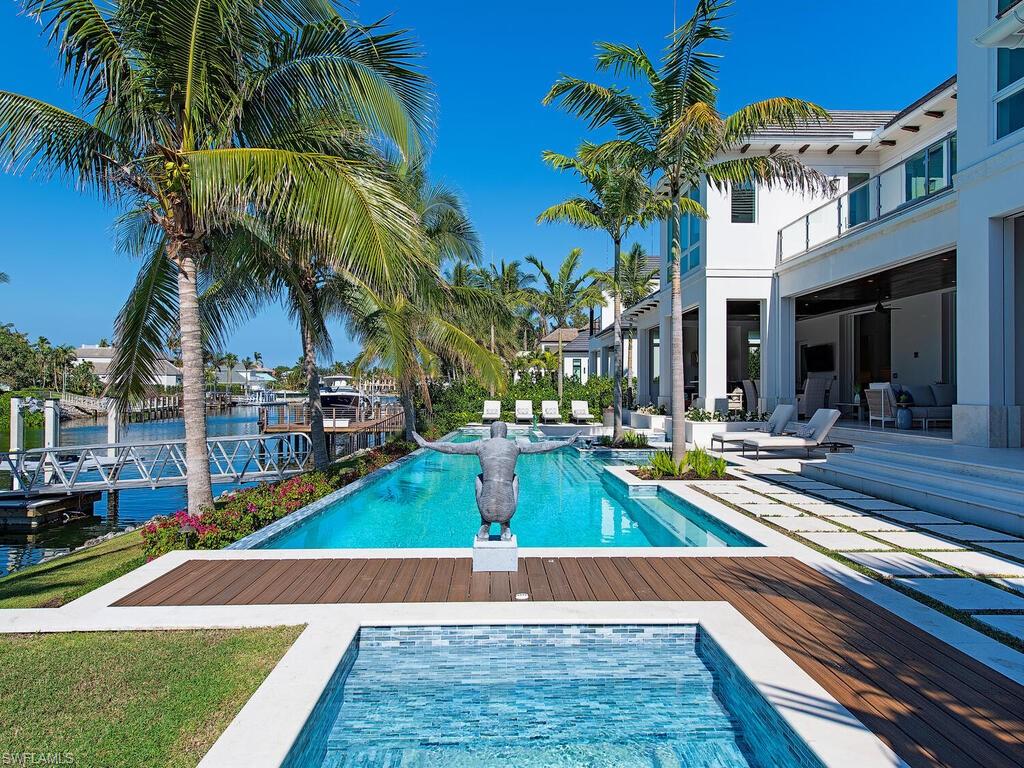 3320 Rum Row Naples, FL 34102 - Photo 7 of 39 a view of a backyard with swimming pool