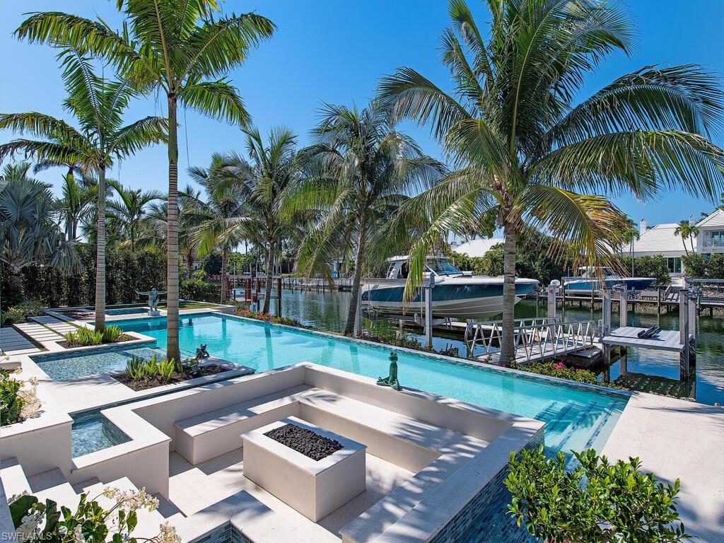 3320 Rum Row Naples, FL 34102 - Photo 8 of 39 a view of a backyard with swimming pool