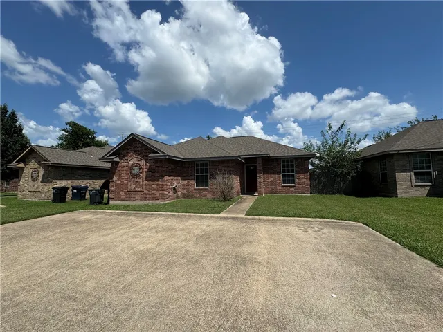 a house view with a garden space