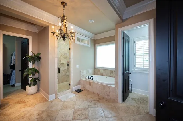 a bathroom with a tub shower and sink