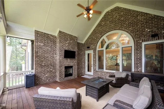 a living room with furniture a window and a fireplace