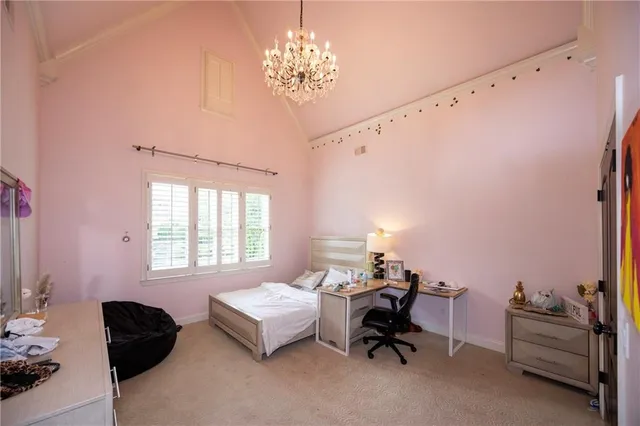 a bedroom with bed and a window