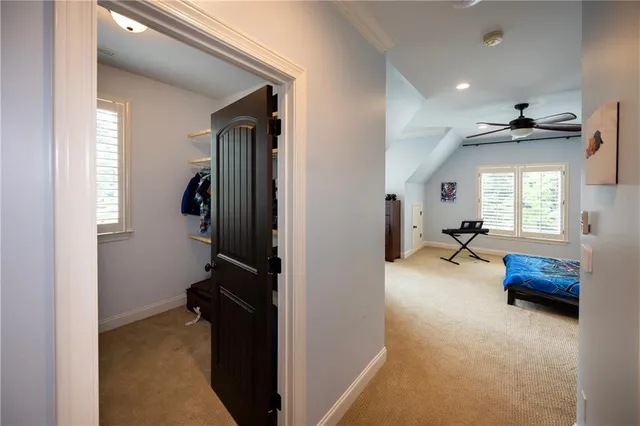 a view of hallway with livingroom and furniture