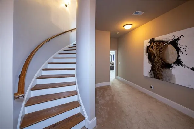 a view of entryway with stairs and wooden floor