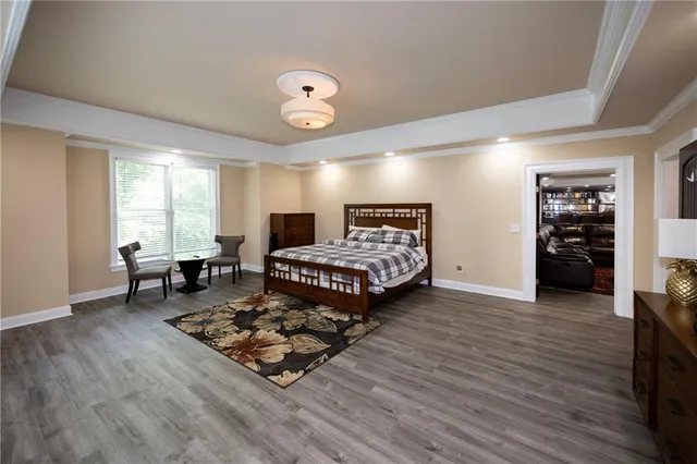 a living room with furniture flat screen tv and window