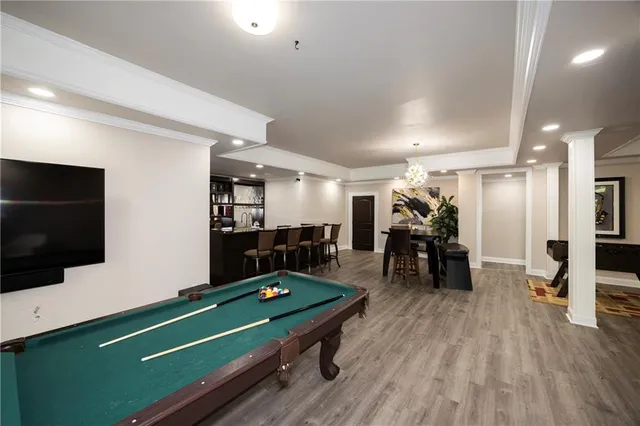 a room with furniture and flat screen tv