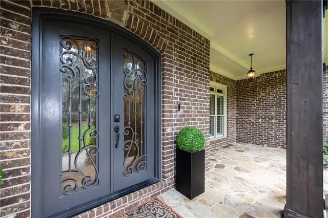 a view of a door and chair in the balcony